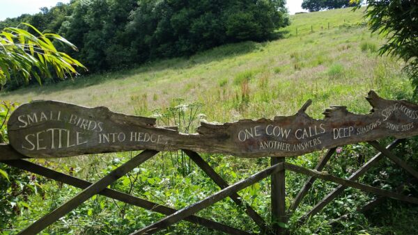 The gate of a care home inscribed with a poem