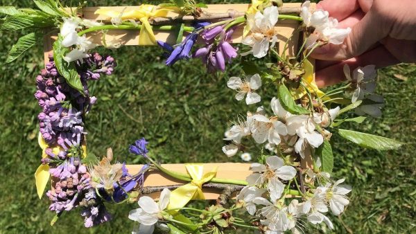 A frame made of leaves and flowers