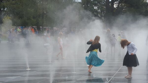 Children playing in water mists