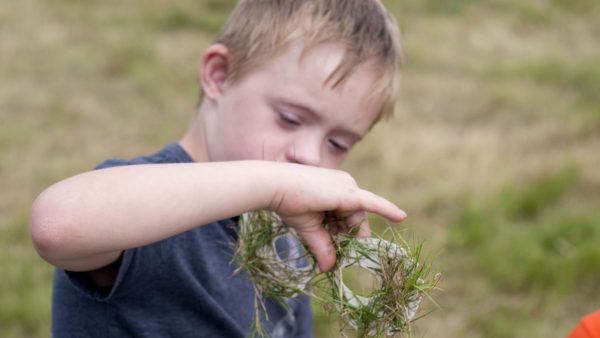 Young boy immersed in nature activity