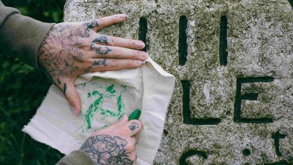 Taking a rubbing with crayon