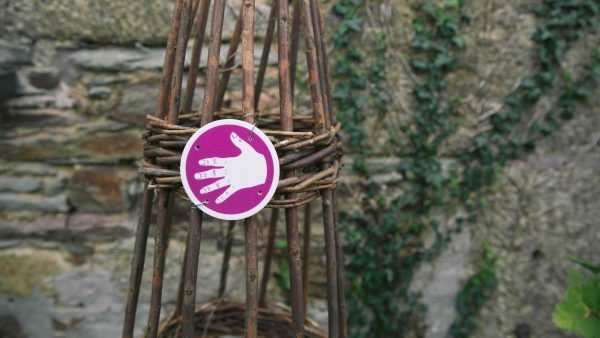 A hand symbol from Sensory Trust's sensory trail marker kit