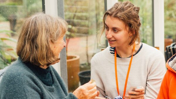 Two women chatting in a workshop