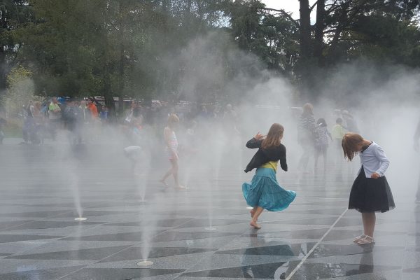 Children playing in water mists