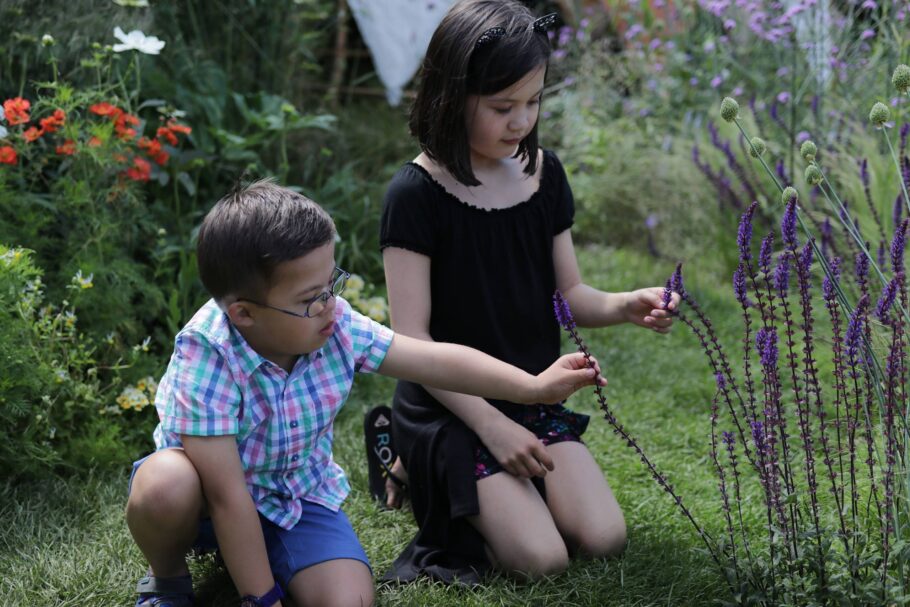 Girl and boy exploring Sensory Trust's garden at Hampton Court show